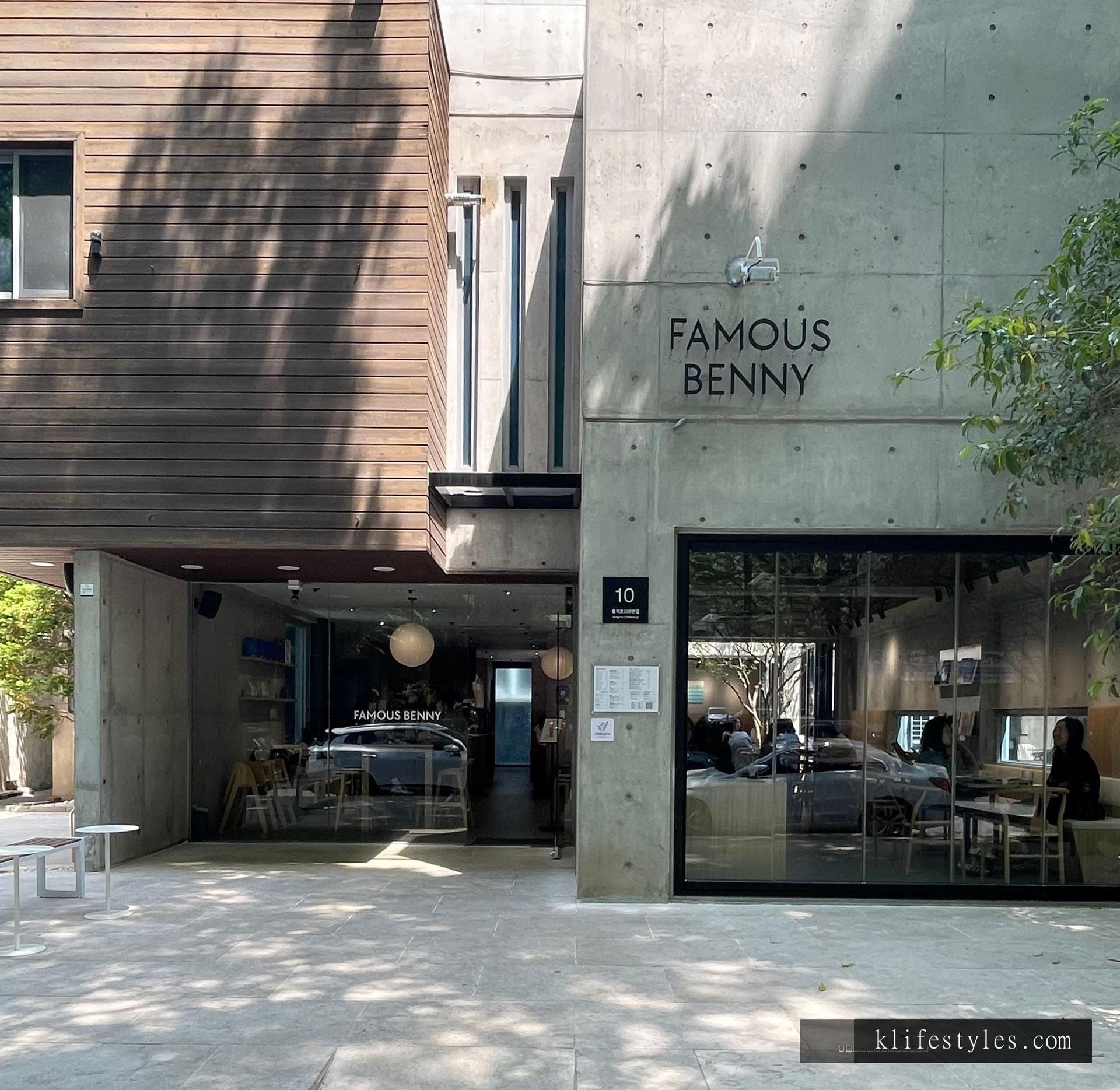Famous Benny café interior in Changwon Garosugil, warm afternoon light filtering through large windows onto wooden tables